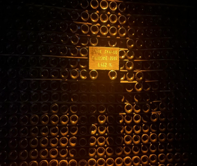 Champagne cellar with Millésime 2018 bottles